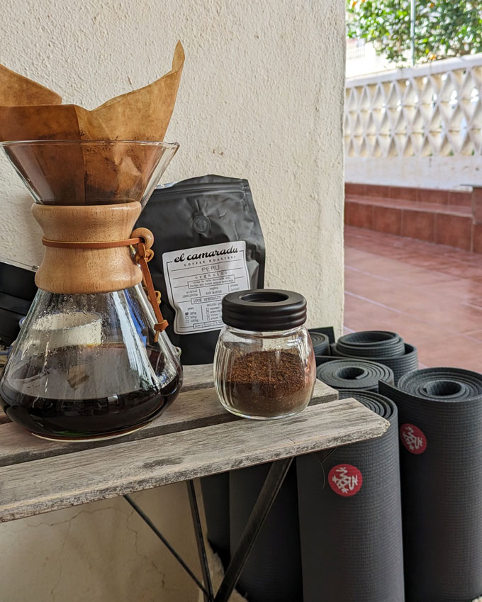 Filter coffee setup alongside yoga mats